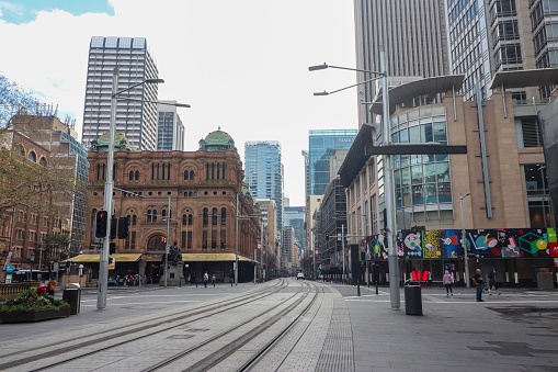 Sydney, Australia – August 28, 2022: A street with Toursitis in Sydney Queen Victoria Buil near Sydney Harbour