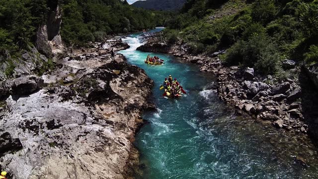 Tourists rafting in rubber boats on the river in HD