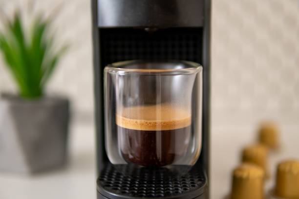 istock Coffee machine with glass of coffee 1453262693