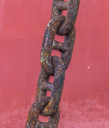 A closeup shot of a rusty anchor chain