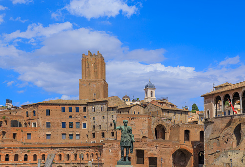 Urban view of Rome: Imperial Forum of Trajan seen from Via dei Fori Imperiali, Italy.