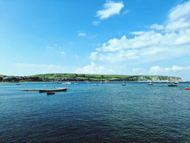 Swanage, United Kingdom – July 30, 2021: A landscape view from Swanage pier looking across the bay. UK