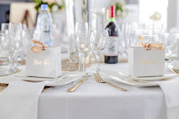 istock Closeup of a table decorated with small gift boxes at a wedding ceremony 1453269232