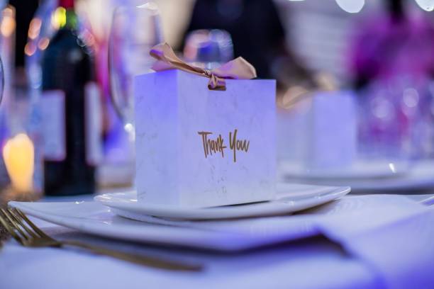 istock Closeup of a table decorated with small gift boxes at a wedding ceremony 1453269237
