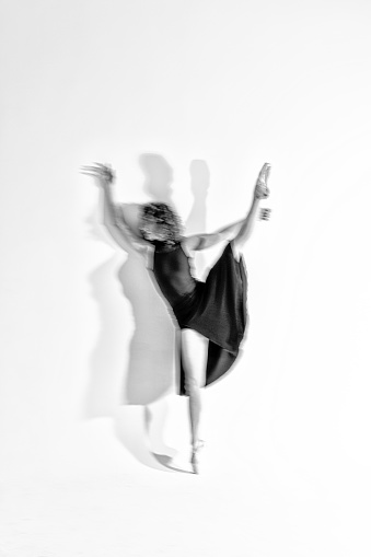 Modern dance with ballet shoes in studio