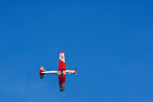 Belly view of Pilatus aircraft PC-7 register A-918 of Swiss Air Force up in the air at Axalp Air Display on a sunny autumn day. Photo taken October 18th, 2022, Axalp, Switzerland.