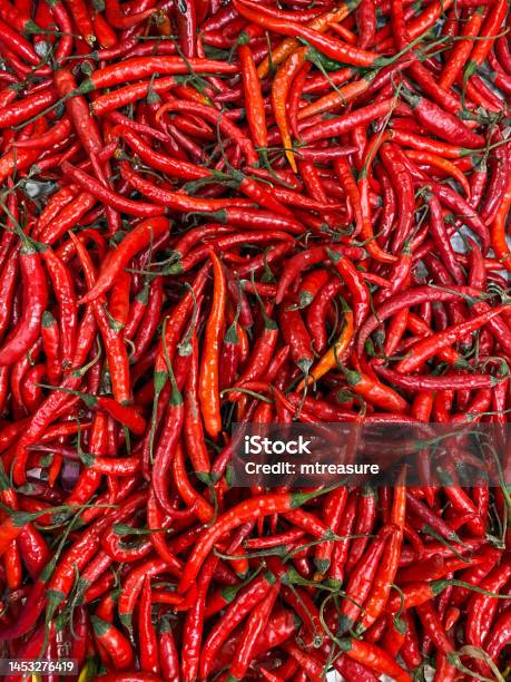 Full Frame Image Of Pile Of Red Chilli Peppers Being Sold At Local Fresh Produce Market Elevated View Stock Photo - Download Image Now