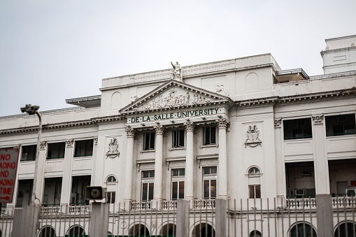 Malate City, Philippines – September 06, 2022: The exterior of the De La Salle University Manila\nPrivate university in Manila, Philippines