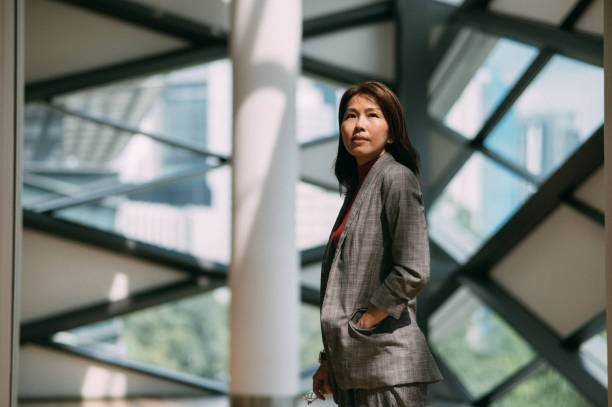 proud asian businesswoman standing in formalwear with copy space. - business malaysia bildbanksfoton och bilder
