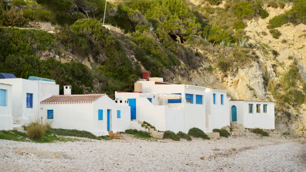 istock white fishermen houses on a pebble beach 1453276765