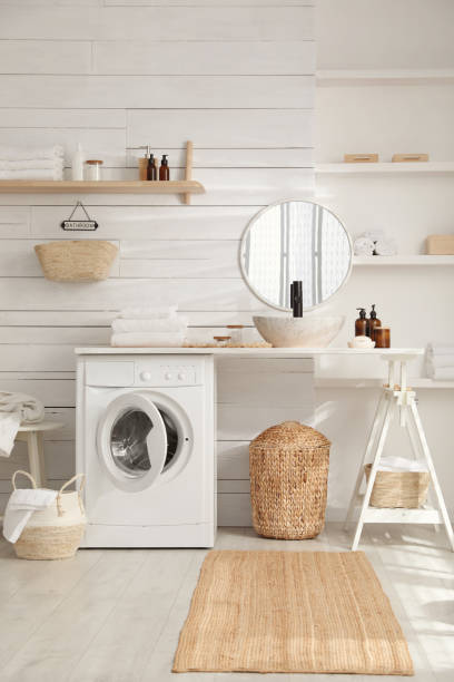 istock Stylish bathroom interior with modern washing machine 1453277547