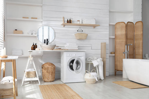 istock Stylish bathroom interior with modern washing machine 1453277550