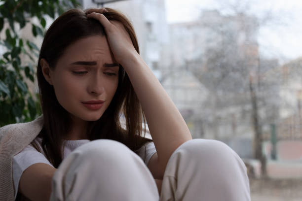 istock Sad young woman indoors, space for text. Loneliness concept 1453277728