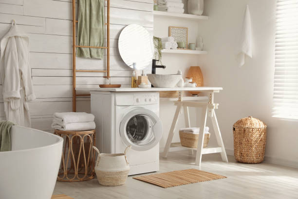 istock Stylish bathroom interior with modern washing machine 1453277900