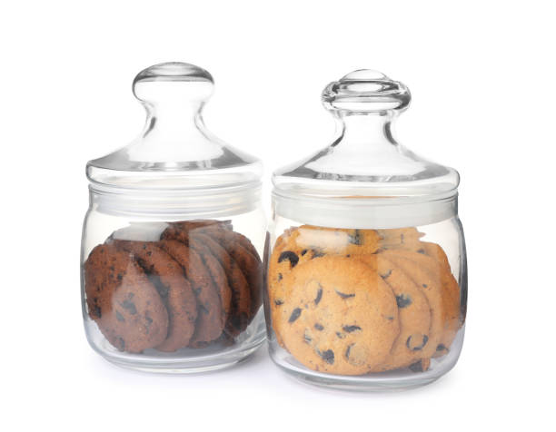 istock Jars of chocolate chip cookies on white background 1453278879