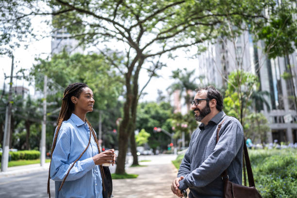 istock Colleagues talking in a financial district 1453279962