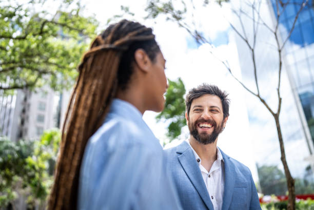 istock Colleagues talking in a financial district 1453279963