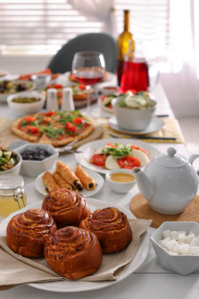 istock Delicious buns and many different dishes served on buffet table for brunch 1453280140