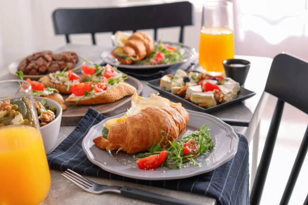 istock Tasty croissant sandwich and many different dishes served on buffet table for brunch 1453280298