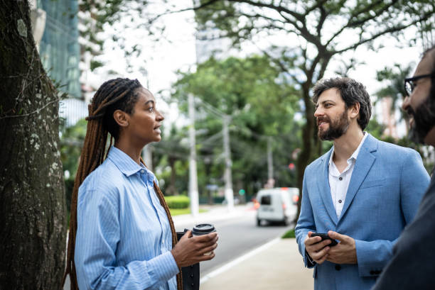 istock Colleagues discussing in a financial district 1453280340