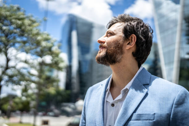 istock Businessman contemplating  in a financial district 1453280362