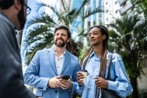 istock Colleagues discussing in a financial district 1453281275