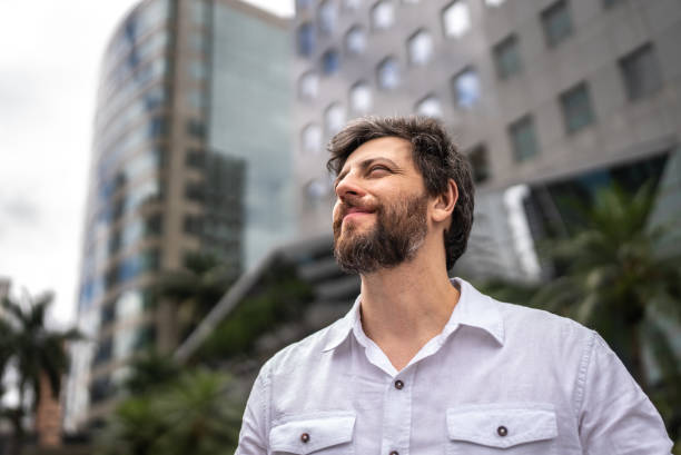 istock Businessman contemplating  in a financial district 1453281397