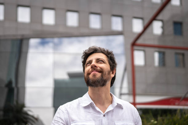 istock Businessman contemplating  in a financial district 1453281398