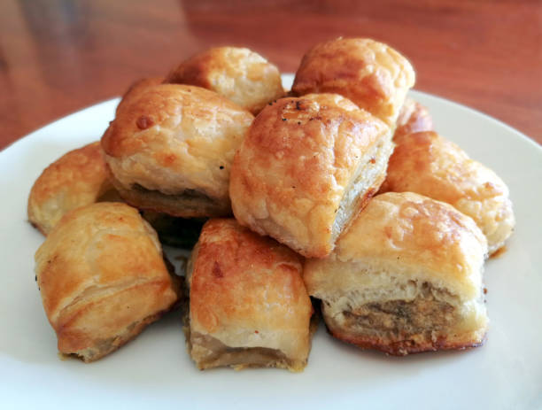 istock Sausage rolls on a white plate. 1453281517