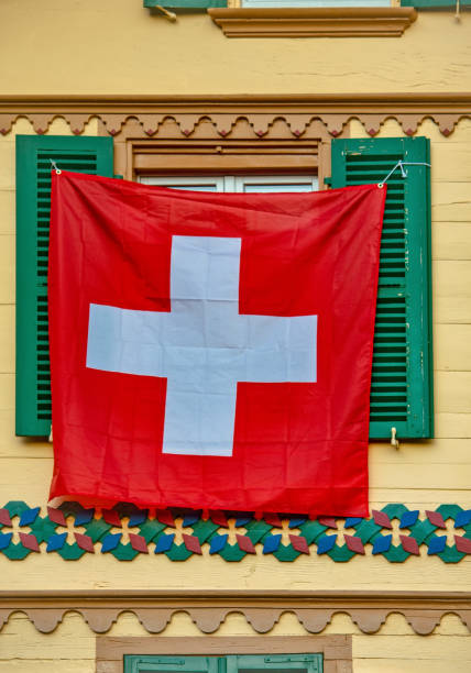 istock Old traditional wooden window with Swiss flags 1453281924