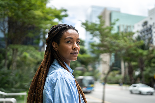 Portrait of a young woman in a financial district