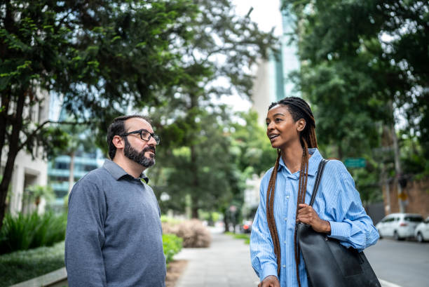 istock Colleagues walking and talking in a financial district 1453282809