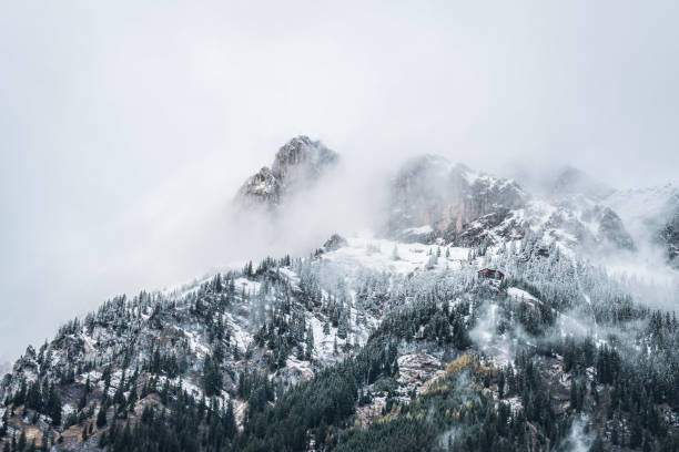 istock Scenic view of mountains covered in clouds 1453286171