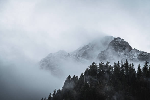 istock Scenic view of mountains covered in clouds 1453286175