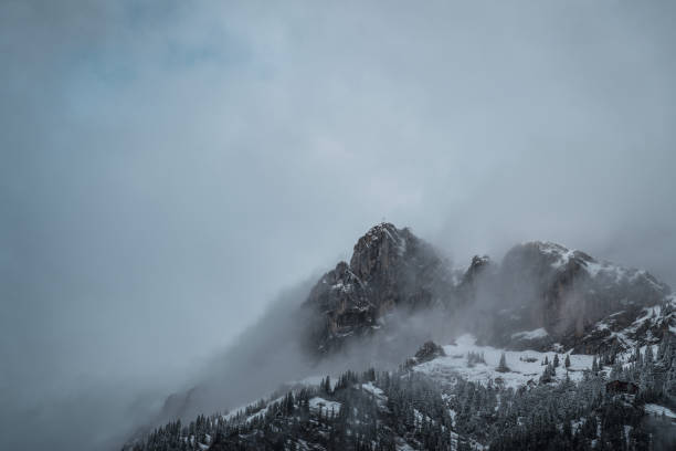 istock Scenic view of mountains covered in clouds 1453286179