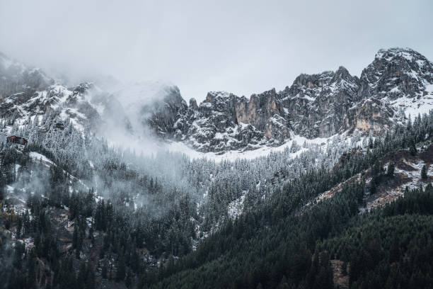 istock Scenic view of mountains covered in clouds 1453286183