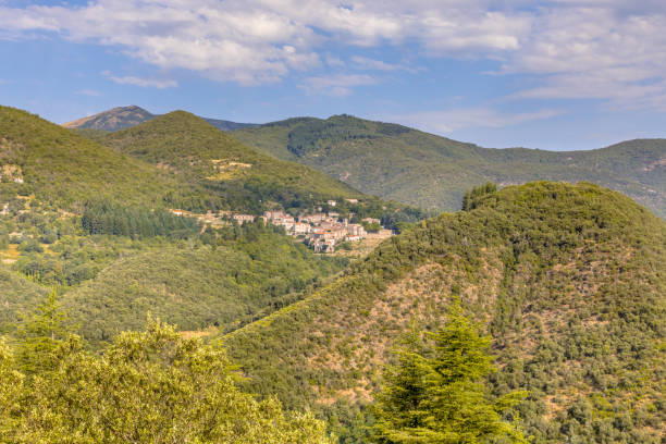 istock Forested mountains of Cevennes with small village 1453286255