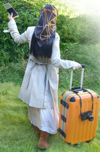 Image for Traveling with A Woman Carrying Suitcase