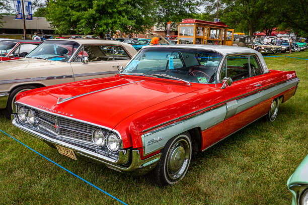 Iola, WI - July 07, 2022: High perspective front corner view of a 1962 Oldsmobile Starfire Hardtop Coupe at a local car show.
