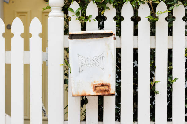 istock White metal mailbox on a fence 1453290805