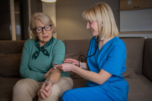 istock Nurse helping senior woman 1453291994