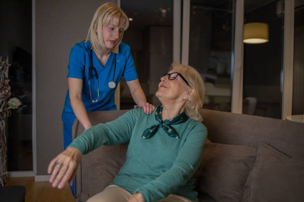 istock Retired woman with female home carer 1453292000