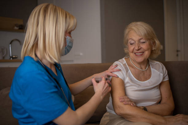istock Nurse helping senior woman 1453292017
