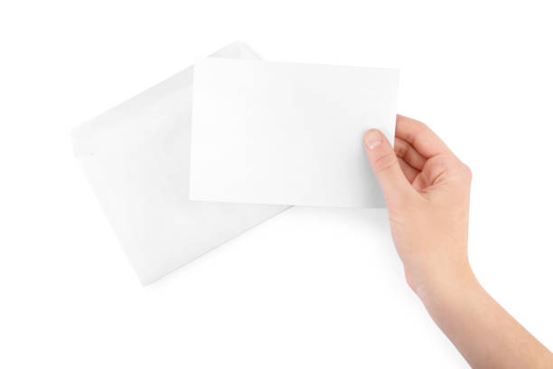istock Woman holding blank letter on white background, top view 1453295001