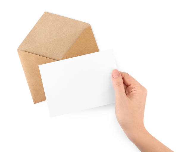 istock Woman holding blank letter on white background, top view 1453295129