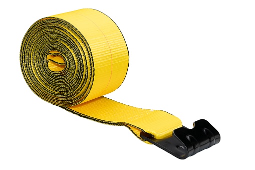A scroll of a yellow cargo strap with stainless steel buckle for the roof rack on a white background