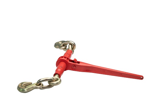 A metallic red ratchet chain binder with silver crooks for securing the load isolated on the white background