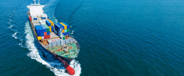 istock Aerial side view of cargo ship carrying container and running for export  goods  from  cargo yard port to custom ocean concept technology transportation , customs clearance. 1453307239
