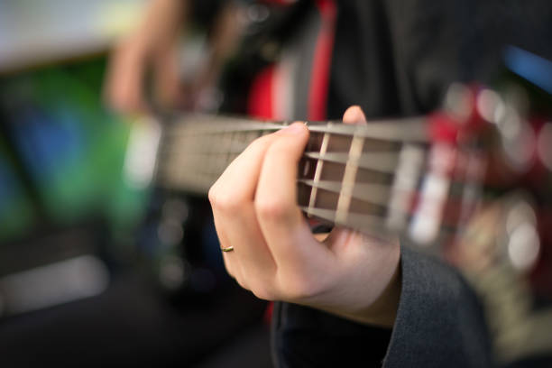 istock Closeup shot of playing guitar 1453314706