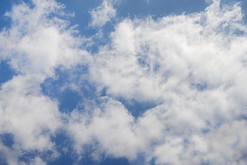 Cumulus clouds on blue sky background